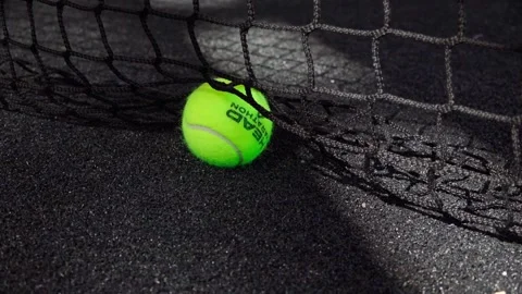 Tennis ball touching the net after a serve on a paddle court Stock Footage 300301703