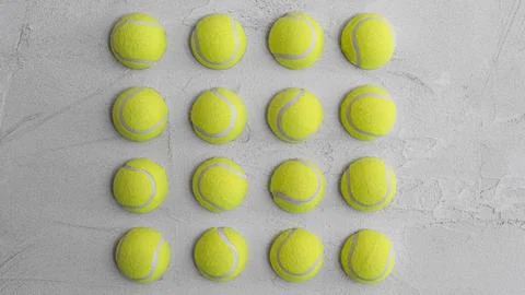Tennis Balls Arranged in Grid Pattern on Concrete Wall Stock Photos