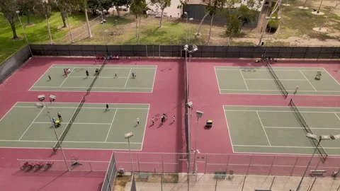 Tennis complex with multiple courts during busy day. 動画素材 162085669