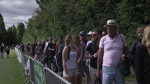 Tennis fans queue for opening day at Wimbledon Stock Footage 148583705