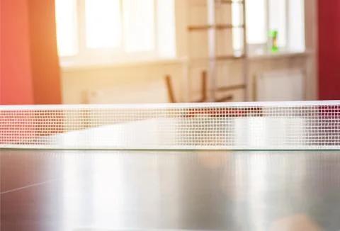 Tennis net on the background of the window in which the sunset. The concept of Foto stock