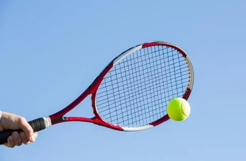 Tennis player hitting the ball Stock-Fotos