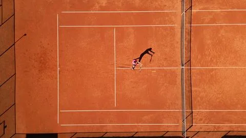 Tennis Player Practicing Dynamic Movement on Clay Court Stock Photos