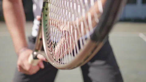 Tennis Player Practicing Racket Strings on Hardcourt Vidéo 317959005
