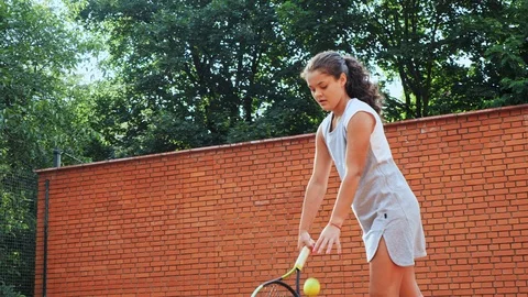 Tennis player practising her serve technique at training Stock Footage 91666577