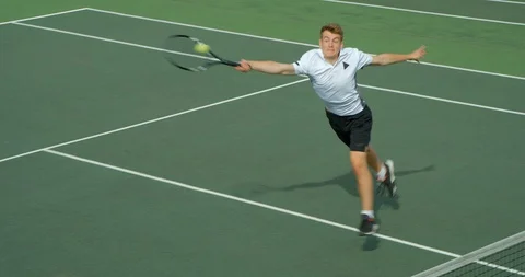 A Tennis Player runs to return in slow motion. 스톡 동영상 101284304