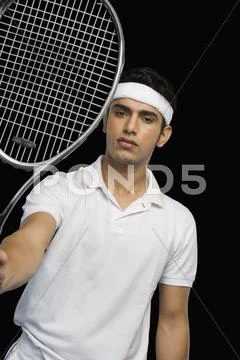 Tennis player showing a tennis racket Stock Photos