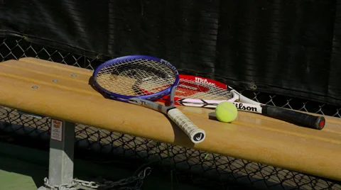 Tennis Rackets and Balls on Bench Stock Footage 35224669