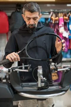 Tennis stringer doing racket stringing Stock Photos