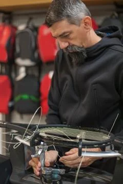 Tennis stringer doing racket stringing Stock Photos