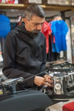 Tennis stringer doing racket stringing Stock Photos