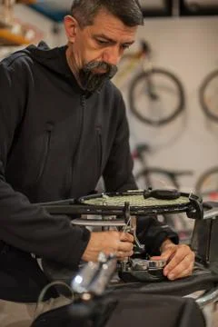 Tennis stringer doing racket stringing Stock Photos