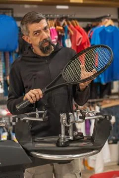 Tennis stringer doing racket stringing Stock Photos