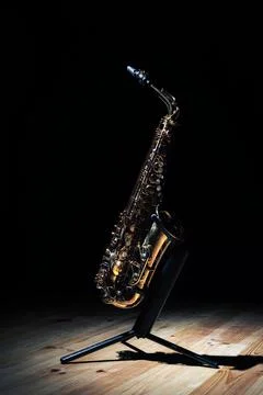 Tenor sax placed on stage during concert Stock Photos
