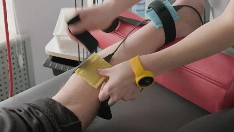 TENS, Transcutaneous Electrical Nerve Stimulation in Physical Therapy. Stock Footage 237076583