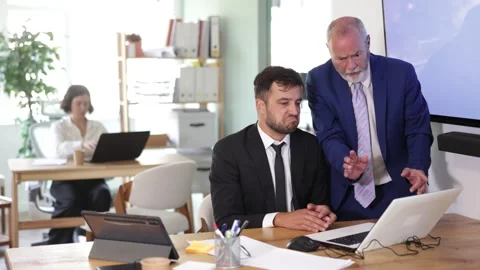 Tense head of the office is angry and scolds at the male employee, he explains Video stock 344775918