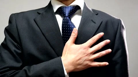 A tense person in a suit 스톡 동영상 336408395