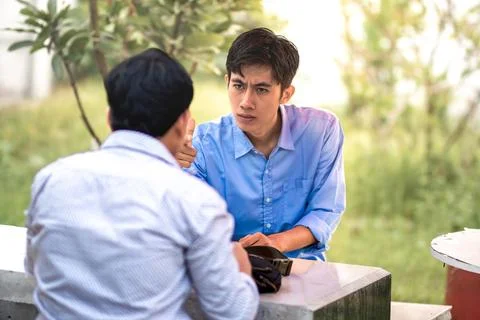 In a tense situation between men. at odds with each other. Internal conflic.. Stock Photos