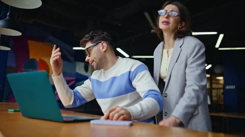 Tensed managers reacting fail at office laptop closeup. Colleagues losing money Stock Footage 335313685