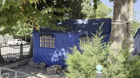 A tent among the trees Stock Footage 246256869