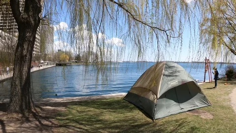 Tent and Tree Overlooking the Lake in the Wind Stock Footage 130050863