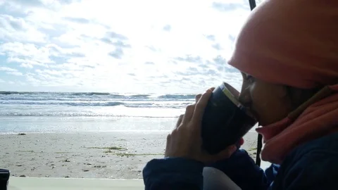 Tent on the beach. 4k. view from the tent on the sea. girl sitting in tent Video stock 82147441