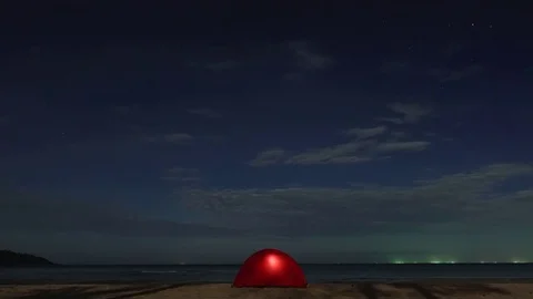 Tent on the beach under moonlight time lapse shot Stock Footage 83371677