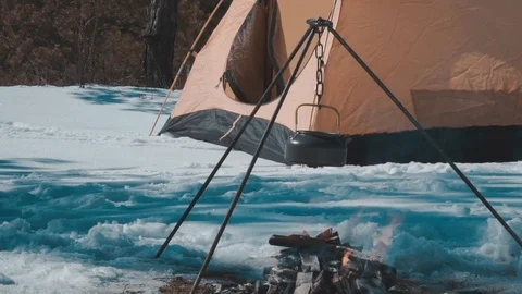 Tent, bonfire in the winter forest Stock Footage 87586283