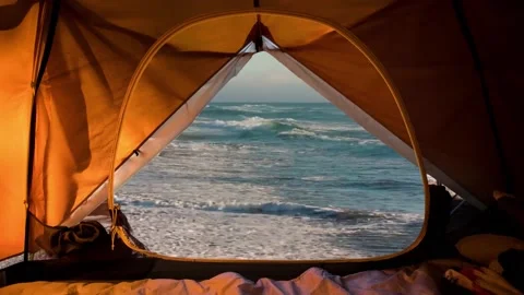Tent camp. Sea view from inside a tent. Video stock 157534573