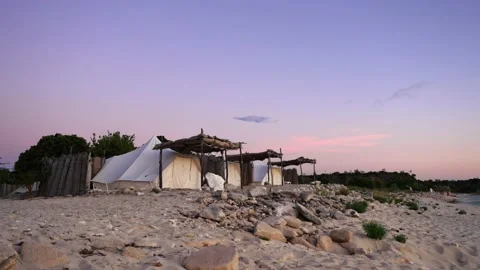 Tent camp on the seashore at sunset. Stock Footage 165606495