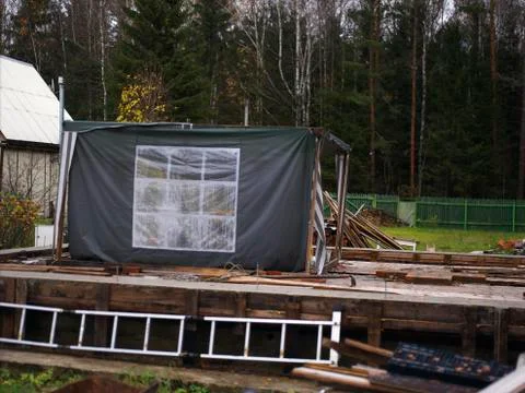Tent in construction area Фото