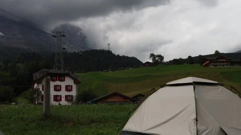 Tent with dark storm clouds in the background, dangerous weather establisher Stock Footage 281950039