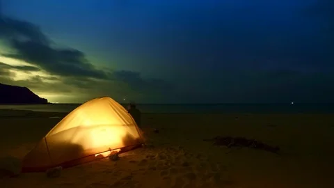 Tent on an empty beach time-lapse at night from dusk Stock Footage 124571175