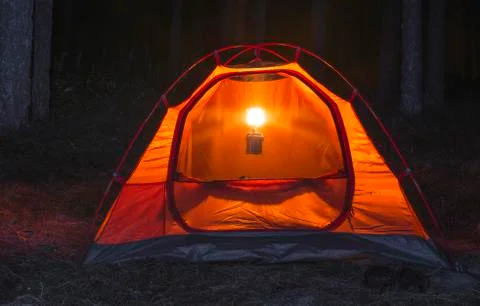 Tent in the forest at night Stock Photos