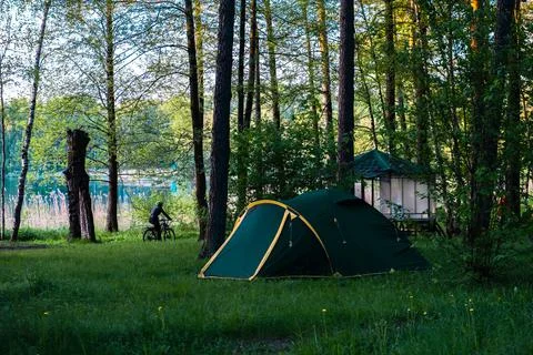 A tent in a forest Stock Photos