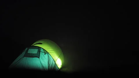 Tent Lit by Lantern During Thunderstorm with Lightning Stock Footage 292521606