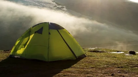 Tent in mountains and clouds Stock Footage 119085356