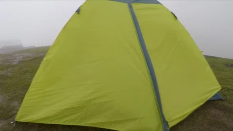 Tent in mountains and clouds Stock Footage 119085369