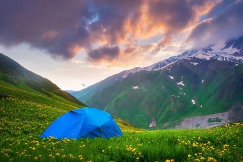 Tent in mountains at sunset Stock Photos