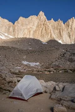 Tent in rugged mountains Stock Photos