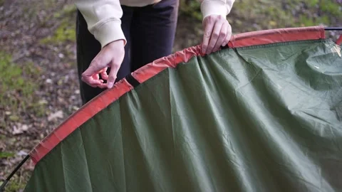 Tent setup, close-up. Camping in the forest. Activities, hiking and trekking Stock Footage 163274330