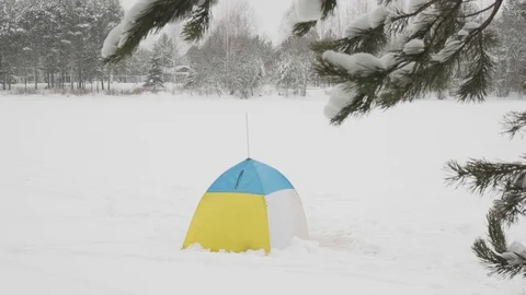 Tent in the snow during snowfall Stock Footage 124046084