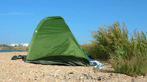 The tent stands on the sandy seashore. Stock Footage 96161912