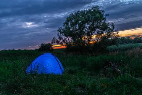 Tent at sunset in the wild Stock Photos