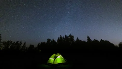 Tent under starry sky - time lapse. Wild camp in European forest. Stock Footage 160526448