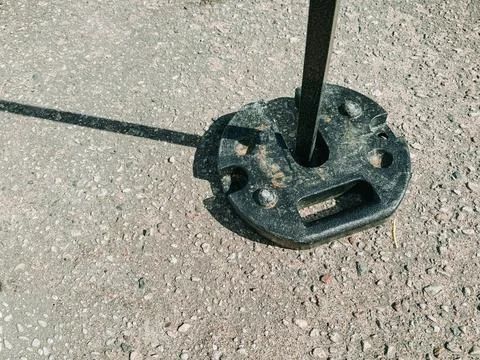 Tent Weight Base on Asphalt Securing Outdoor Canopy Leg 写真素材