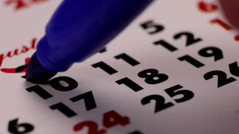 The tenth 10th number circles the blue marker in the calendar macro Stock Footage 234405669