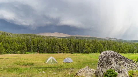 Tents in mountain valley with rain clouds Stock Footage 167413751