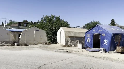 Tents set up side by side for citizens whose houses Stock Footage 246295689