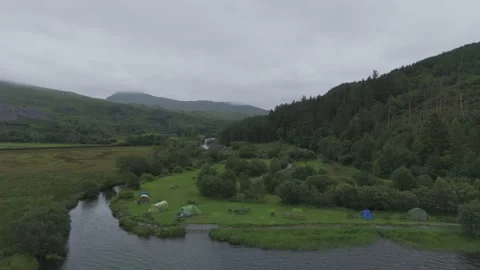 TentsOnWaterEdgePullAway Stock Footage 312275909